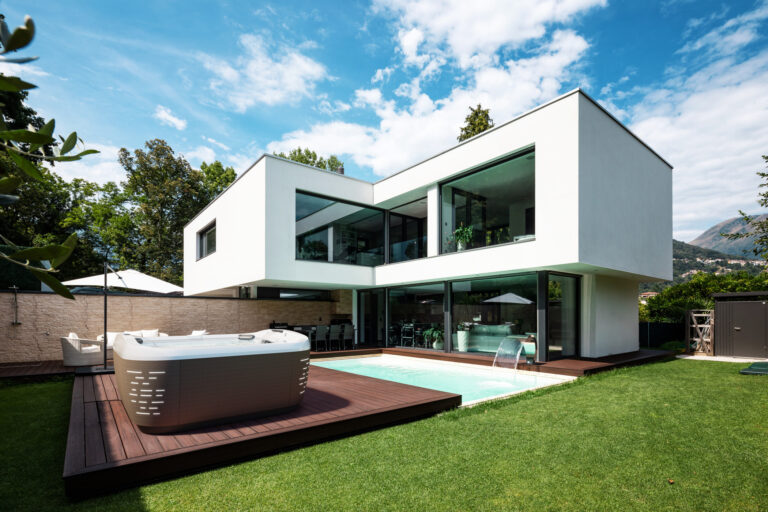 Outdoor hot tub installation outside of a modern home.